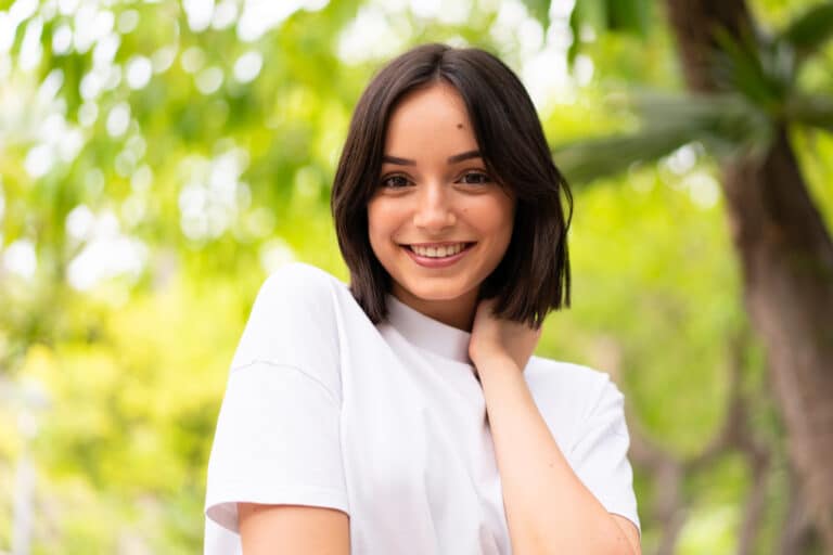 Young happy caucasian woman at outdoors